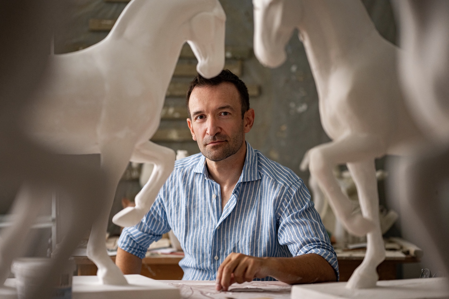 Croatian sculptor Hrvoje Dumančić surrounded by his sculptures